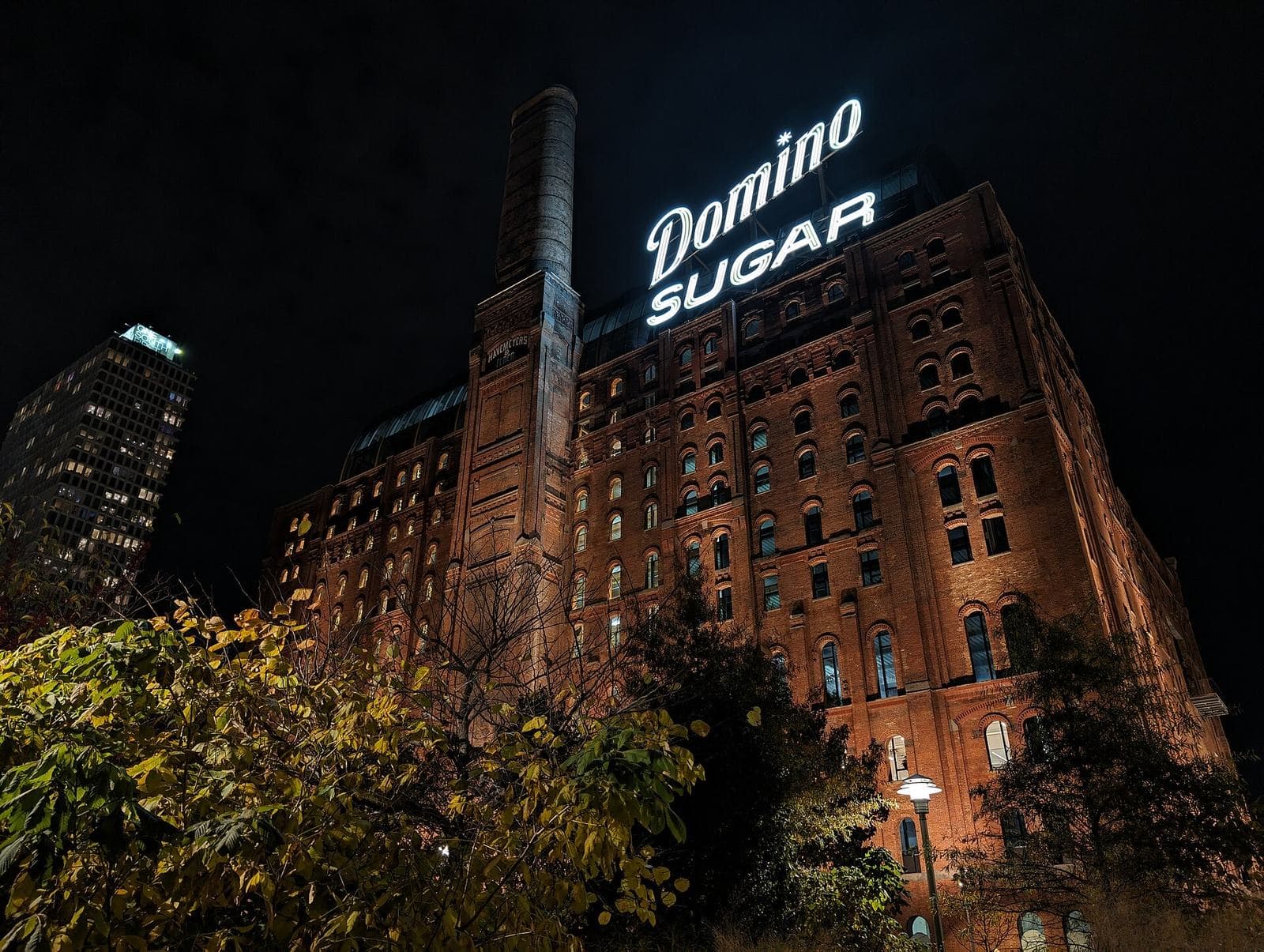 A refinery under floodlight at night