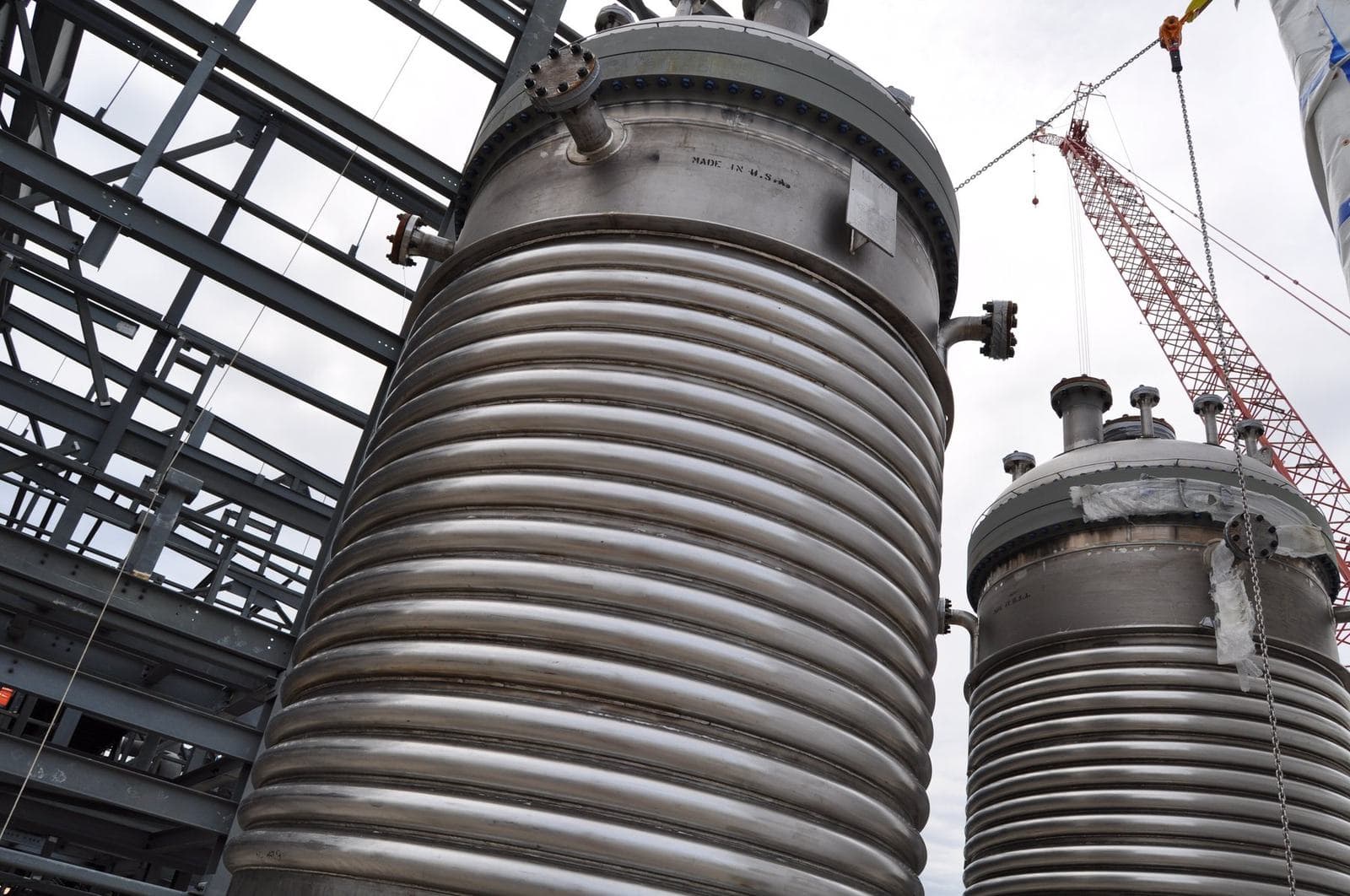 Stainless jacketed process vessels being installed at a chemical plant